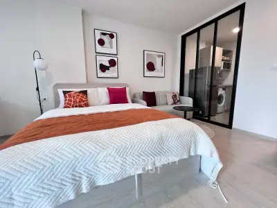Modern studio apartment with stylish decor and in-unit laundry