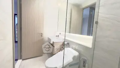 Modern bathroom with sleek design and elegant fixtures in a contemporary home.