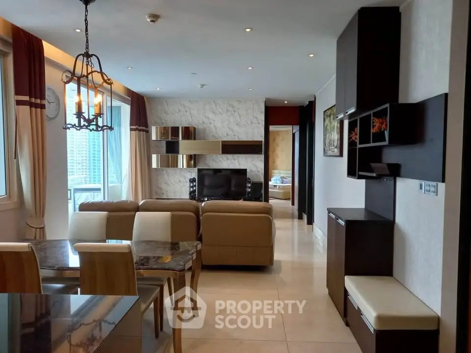 Luxurious open-plan living room with elegant decor and city view