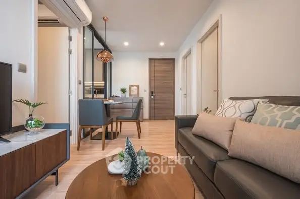 Modern living room with stylish decor and open dining area
