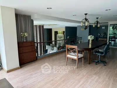 Spacious open-plan living area with elegant dining setup and modern decor