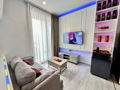 Modern living room with stylish decor, cozy sofa, and entertainment setup, perfect for relaxation and entertainment.