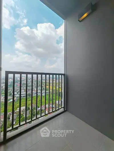 Stunning balcony view with expansive cityscape and lush greenery, perfect for relaxation and enjoying the outdoors.