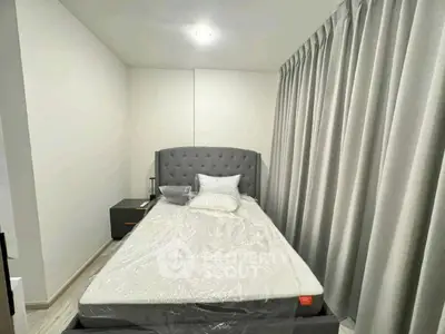 Cozy modern bedroom with elegant gray curtains and stylish headboard