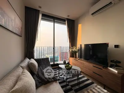 Cozy living room with city view, modern decor, and natural light.