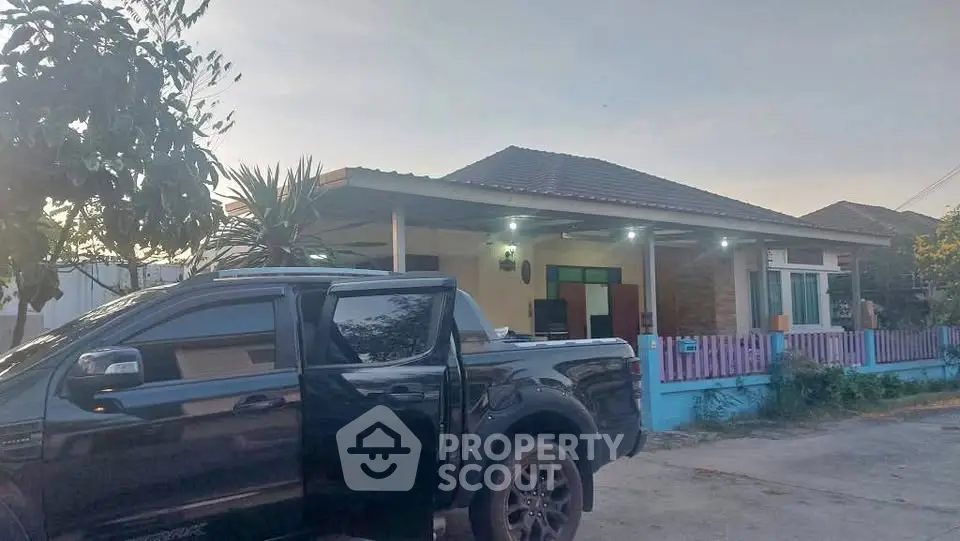 Charming single-story home with spacious front yard and modern exterior design.