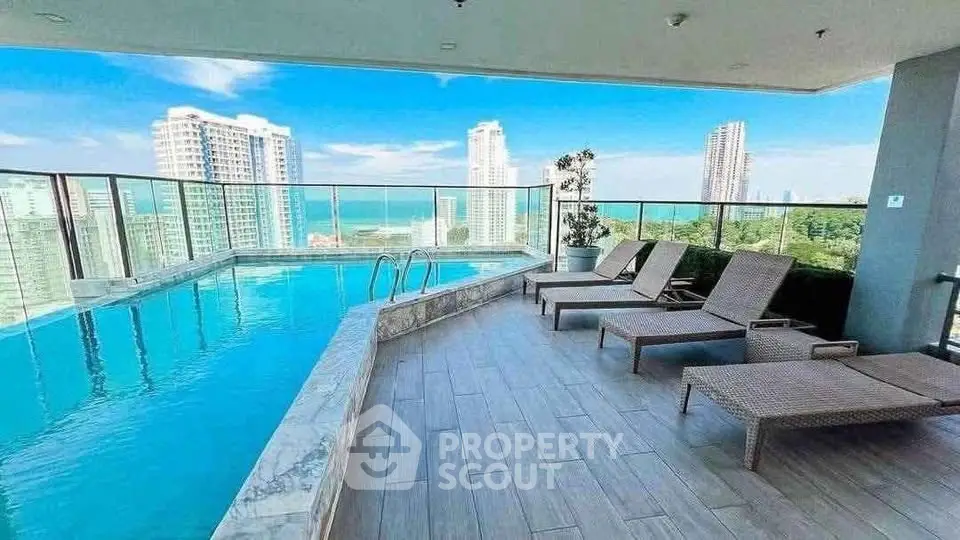 Luxurious rooftop pool with stunning city and ocean views, perfect for relaxation and leisure.