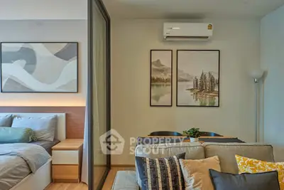 Modern apartment interior with cozy living room and stylish bedroom, featuring elegant decor and air conditioning.