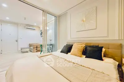 Luxurious bedroom with modern decor and cozy ambiance in a stylish apartment.