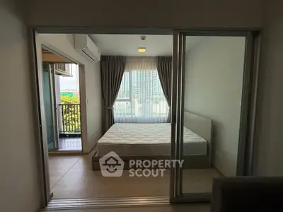 Modern bedroom with balcony view in urban apartment