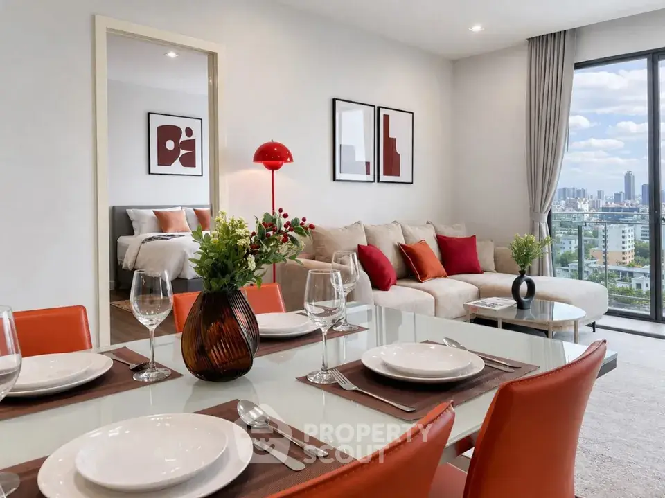 Modern open-plan living room with city view, stylish decor, and dining area in a high-rise apartment.