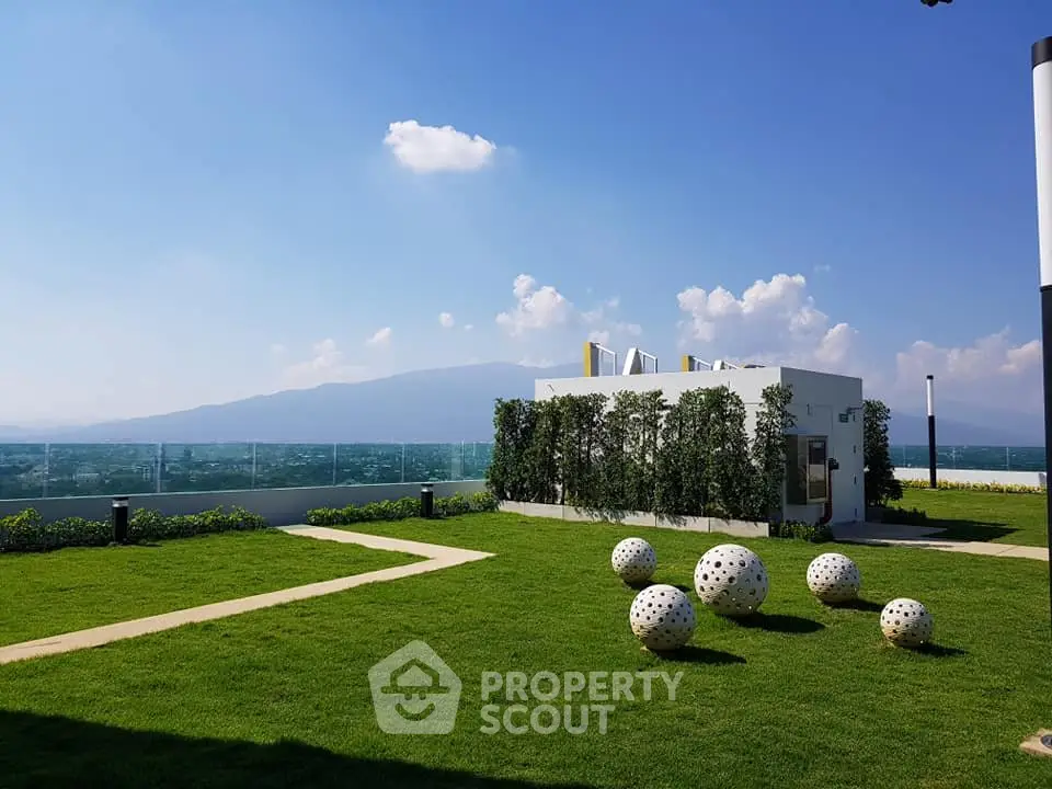 Stunning rooftop garden with panoramic mountain views and modern design elements.