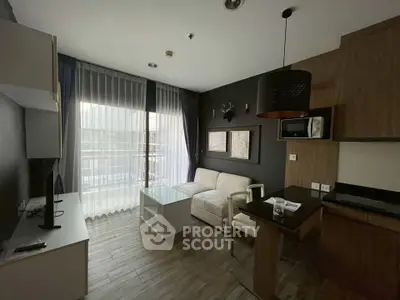 Modern living room with sleek design and natural light, featuring a cozy sofa and stylish decor.