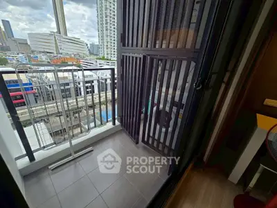Charming urban balcony with cityscape view, perfect for relaxation and enjoying the skyline.