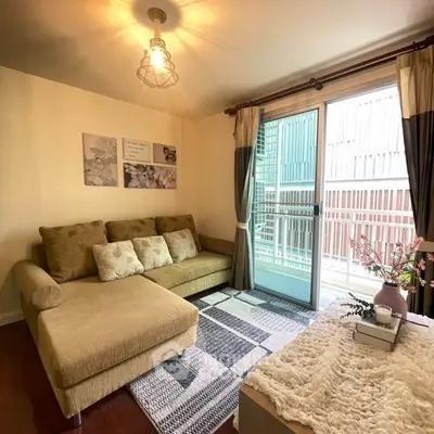 Cozy living room with stylish decor and large window for natural light