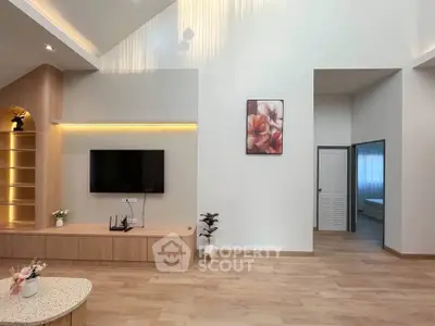 Modern living room with high ceiling and elegant decor