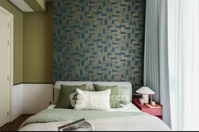 Stylish bedroom with modern decor and textured accent wall, perfect for a cozy retreat.