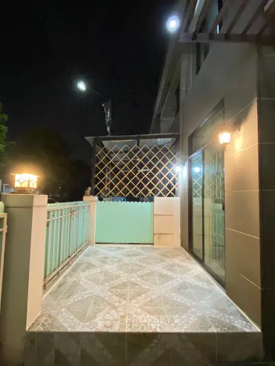 Charming night view of a cozy balcony with elegant lighting and stylish tiles.