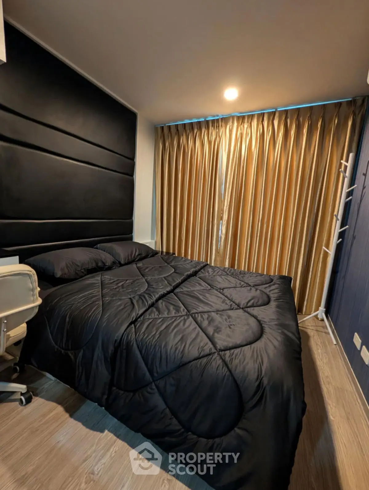 Cozy bedroom with modern decor and luxurious curtains