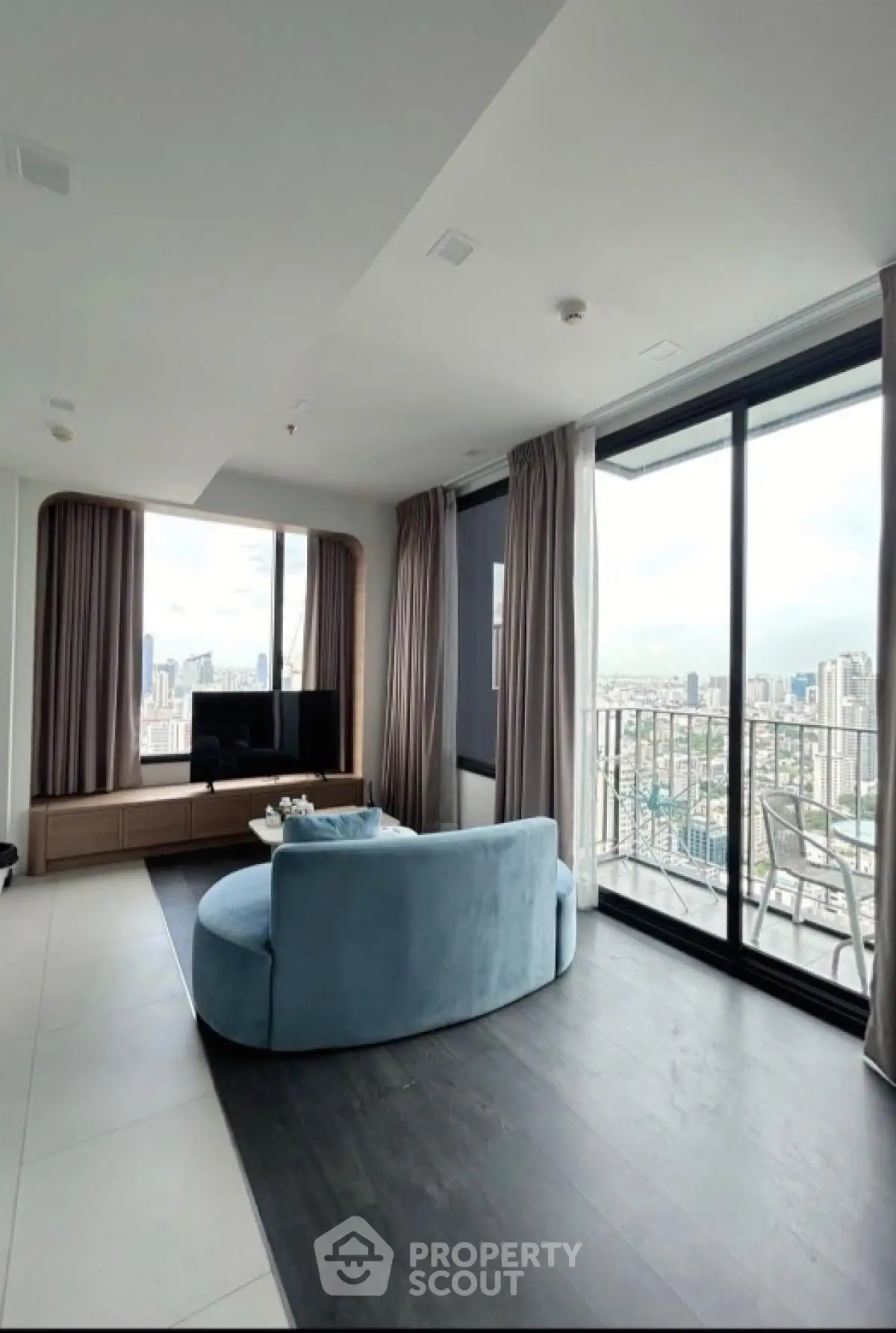 Luxurious living room with panoramic city view and modern furniture