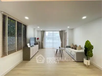 Spacious modern living room with elegant decor and natural light