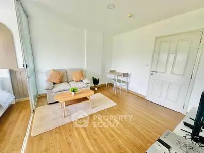 Bright and cozy living room with modern decor and wooden flooring