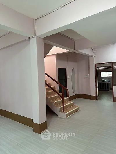 Spacious interior with staircase and modern design, perfect for family living.