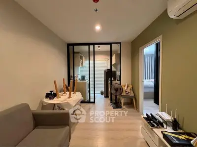 Modern living room with open kitchen and cozy bedroom in stylish apartment