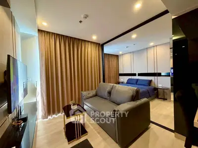 Modern living room with cozy sofa and stylish decor in a contemporary apartment.