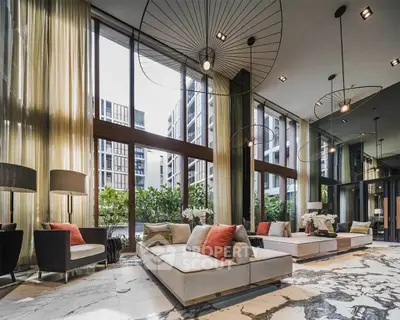 Luxurious modern living room with floor-to-ceiling windows and elegant decor in a high-end apartment.