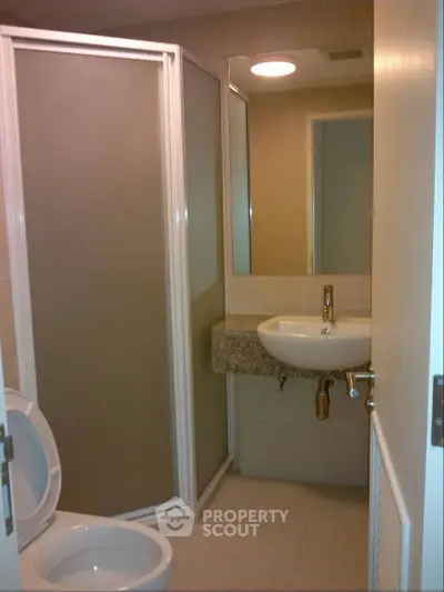Modern bathroom with shower enclosure and sleek sink design