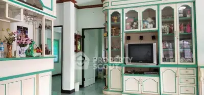 Charming living room with vintage cabinetry and cozy decor