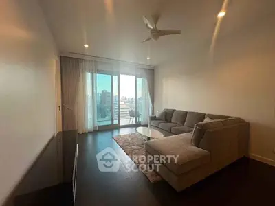 Spacious living room with city view and modern sectional sofa