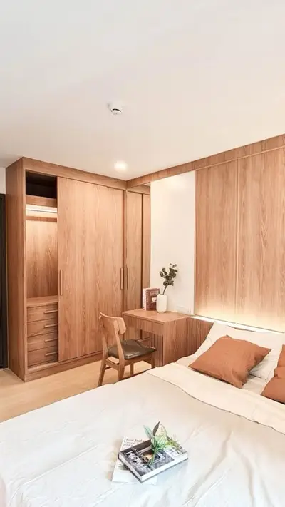 Modern bedroom with wooden furniture and cozy decor