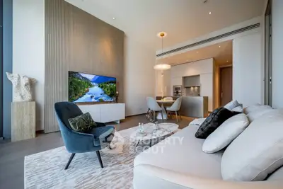 Luxurious modern living room with elegant decor and open kitchen layout, featuring stylish furniture and ambient lighting.