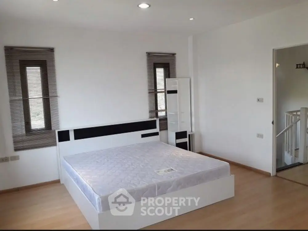 Spacious bedroom with modern design and natural light