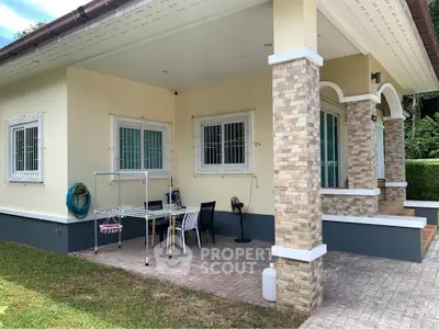 Charming single-story home with spacious patio and lush garden, perfect for outdoor relaxation and entertaining.