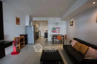 Spacious living room with modern kitchen in open layout apartment