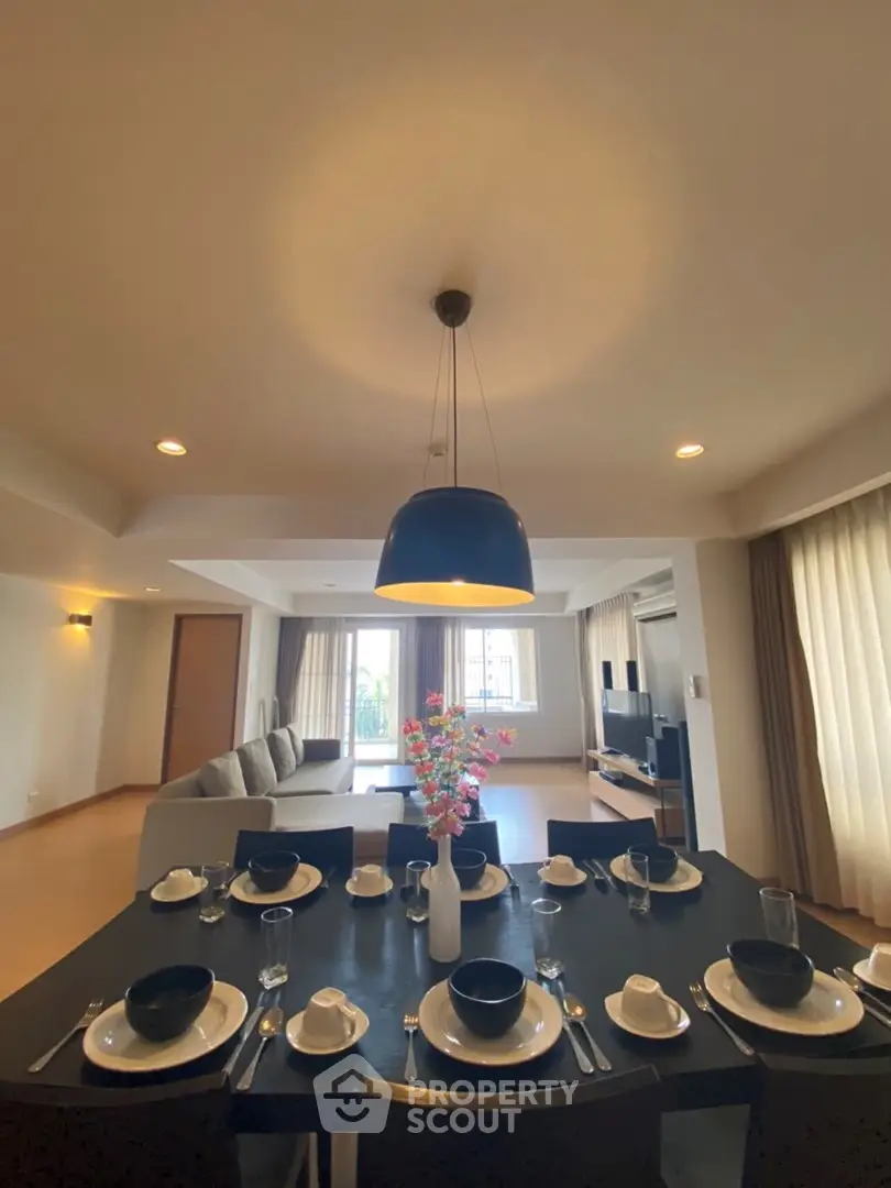 Spacious living room with elegant dining area and modern decor