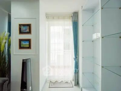 Bright interior with elegant glass shelves and balcony view