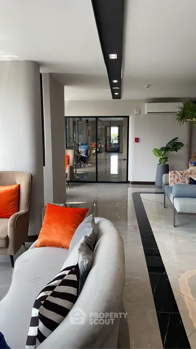 Elegant living room with modern decor and vibrant accents