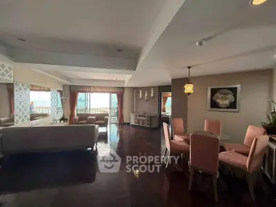 Spacious living room with elegant dining area and stunning sea view, perfect for luxury living.