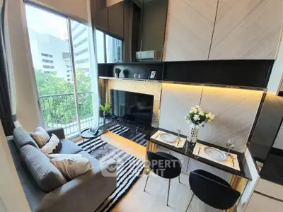 Modern living room with stylish decor and balcony view in urban apartment
