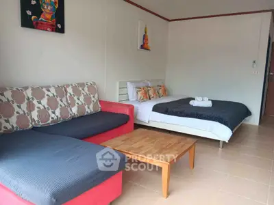 Spacious studio with cozy seating and modern decor