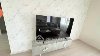Modern living room with sleek TV setup and stylish decor