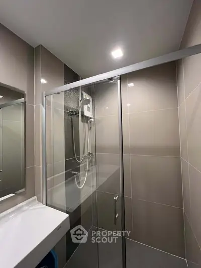 Modern bathroom with sleek shower enclosure and contemporary fixtures