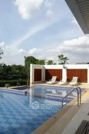 Luxurious outdoor pool area with sun loungers and scenic views, perfect for relaxation and leisure.