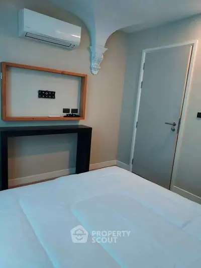 Modern bedroom with air conditioning and minimalist decor