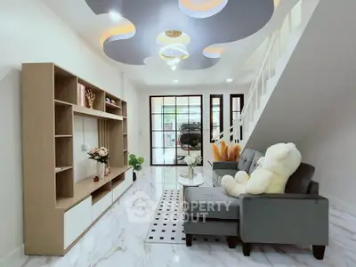 Modern living room with stylish ceiling design and cozy seating area