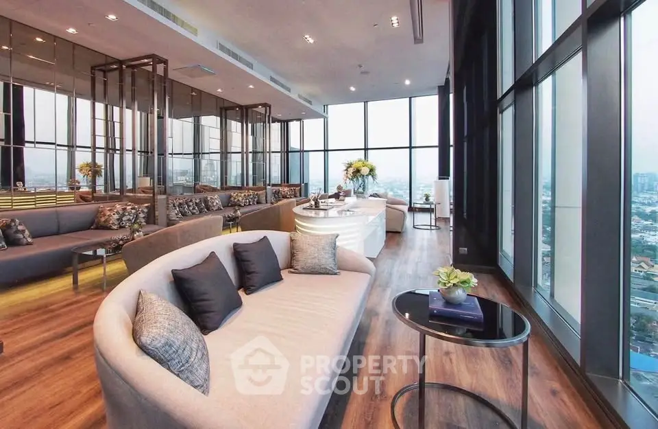 Luxurious modern living room with panoramic city views and elegant decor.